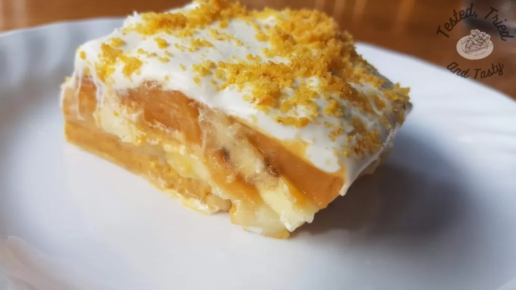 Banana cream pie bars on a white plate.