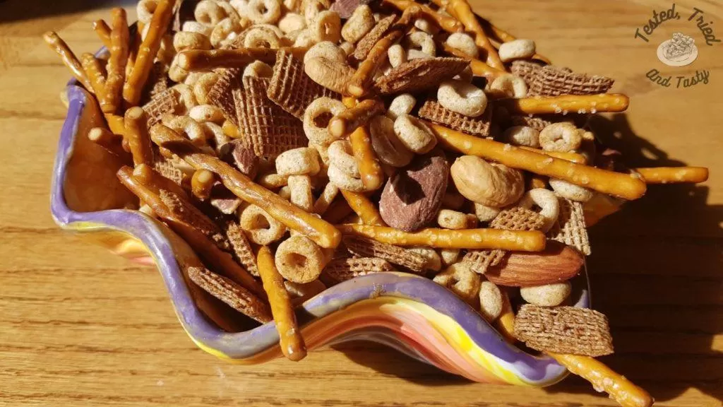Homemade Nuts and Bolts Recipe in a ceramic bowl.