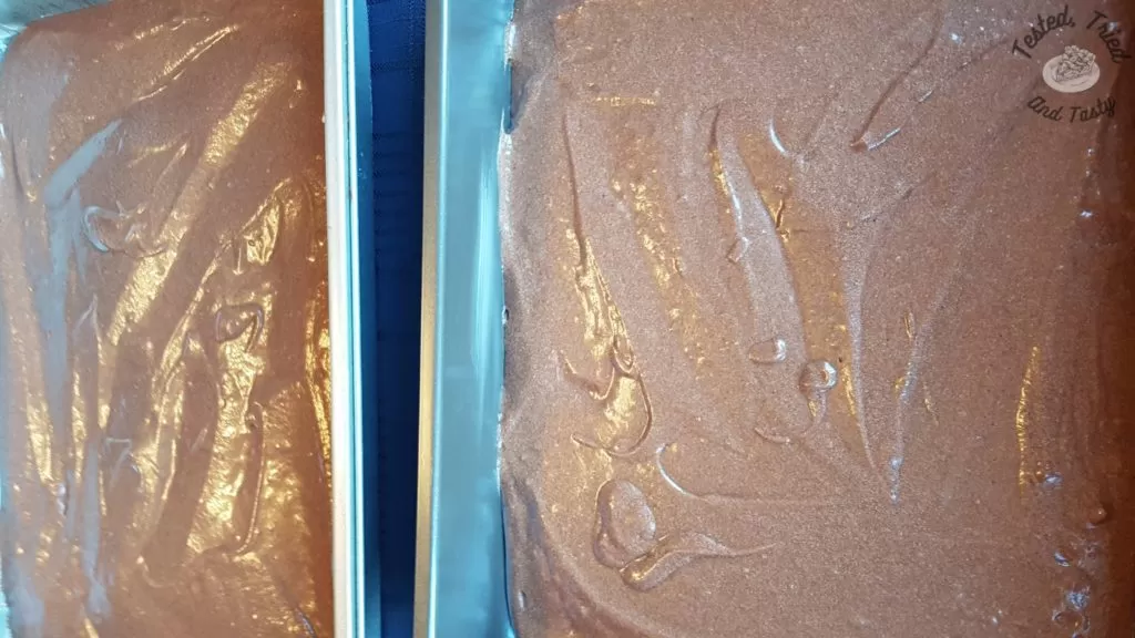 Cake batter for texas brownies poured into 2 9x13 inch pans.