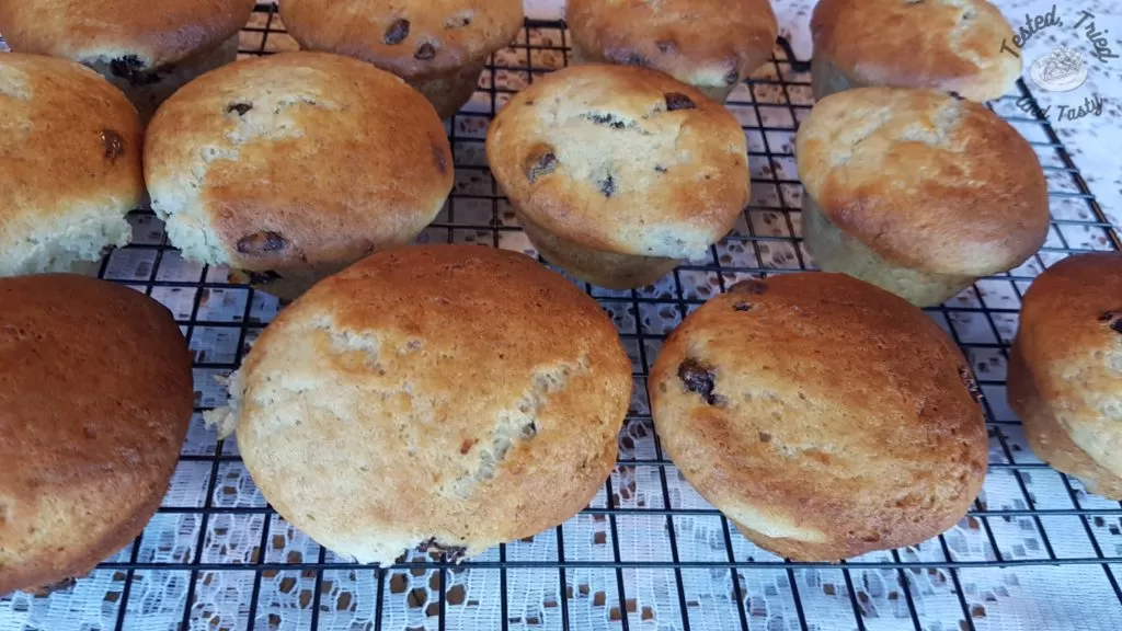 Banana chocolate chip muffins on a wire cooling rack.