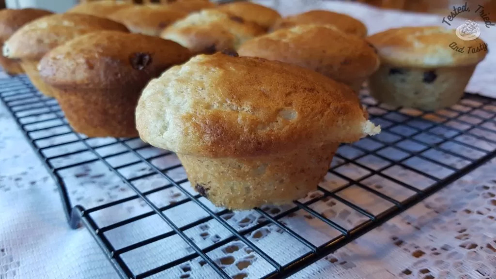 Banana muffins on a wire cooling rack.