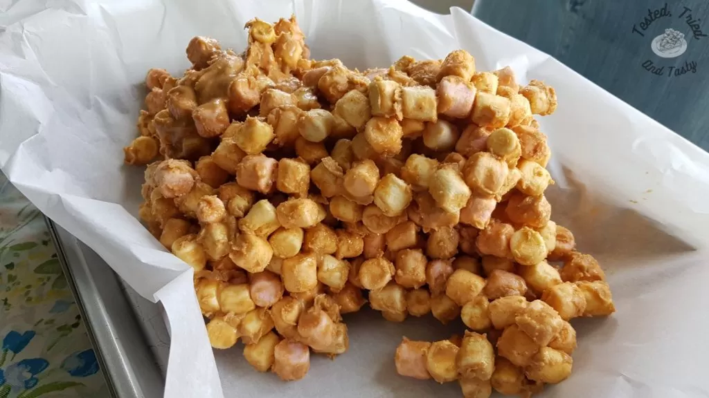 Lovely butterscotch confetti being put into the pan.