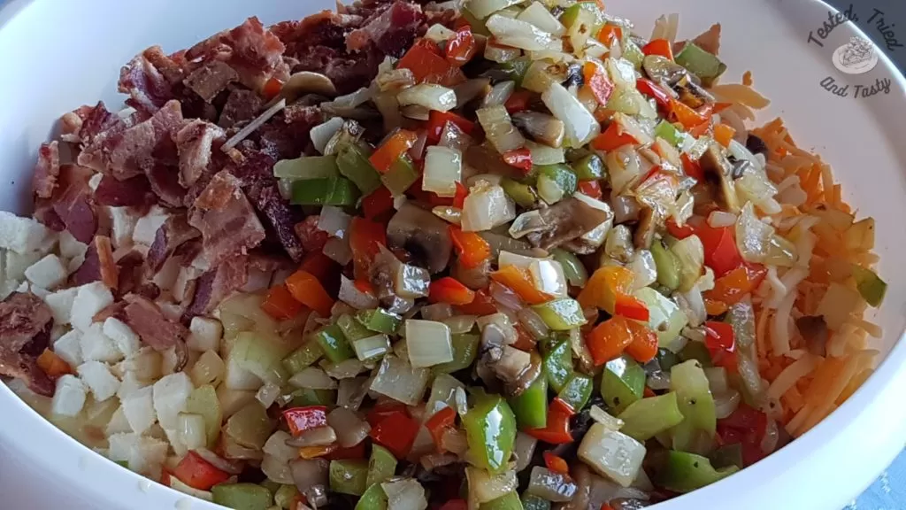 Sauted veggies added to breakfast hashbrown casserole.