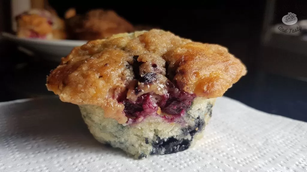 Close up of blueberry muffin with streusel topping.