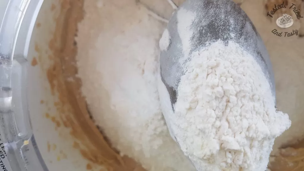 Flour and cookie dough in a bosch mixer.