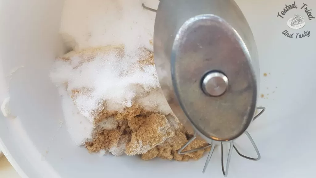 white sugar added to brown sugar and butter in a bosch mixer.