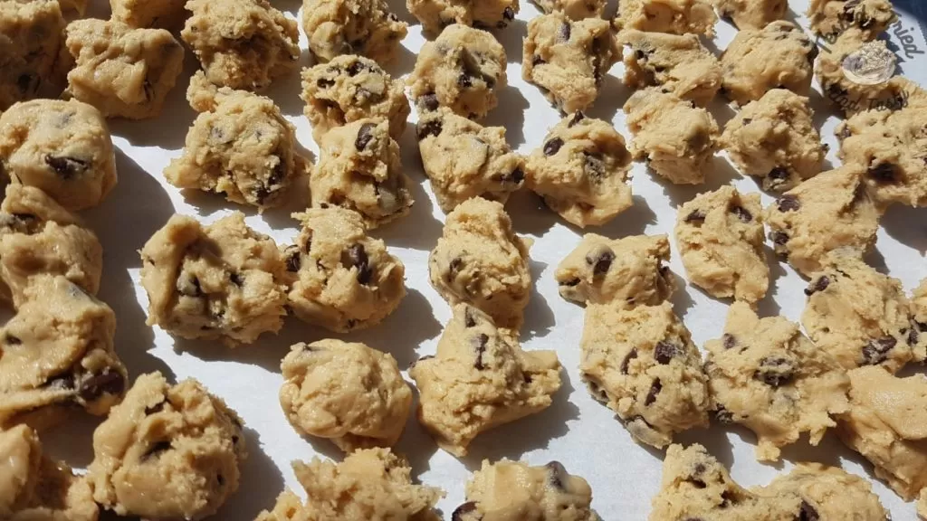 Dough balls ready to be frozen on a cookie sheet.