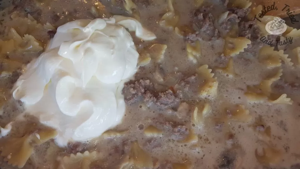 Sour cream added at the end of cooking hamburger helper stroganoff.
