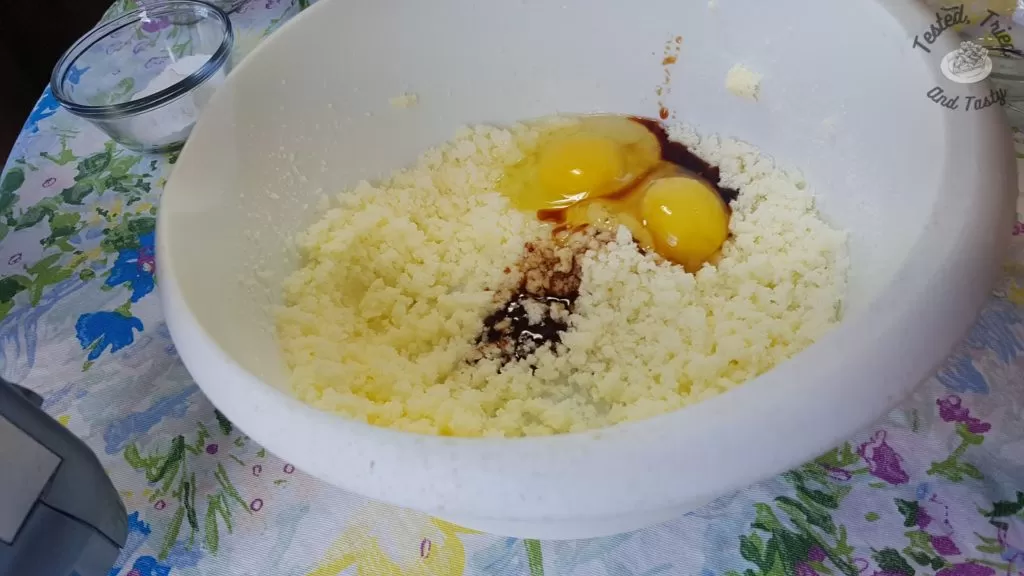 Eggs and vanilla added to the creamed butter and sugar.