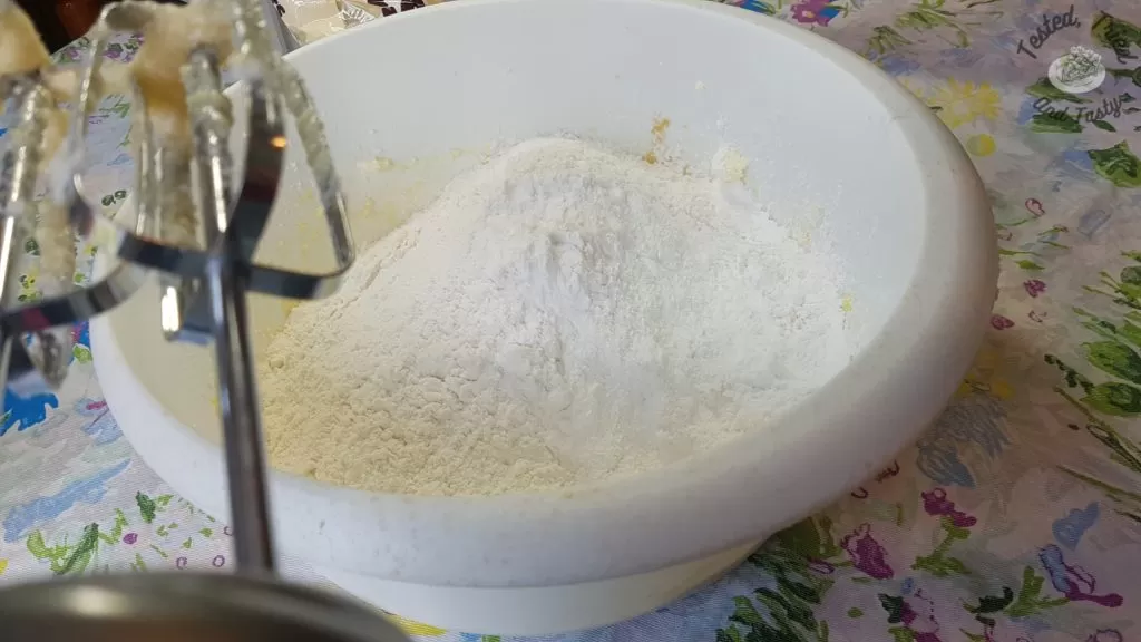 Flour and baking powder added to creamed butter mixture.