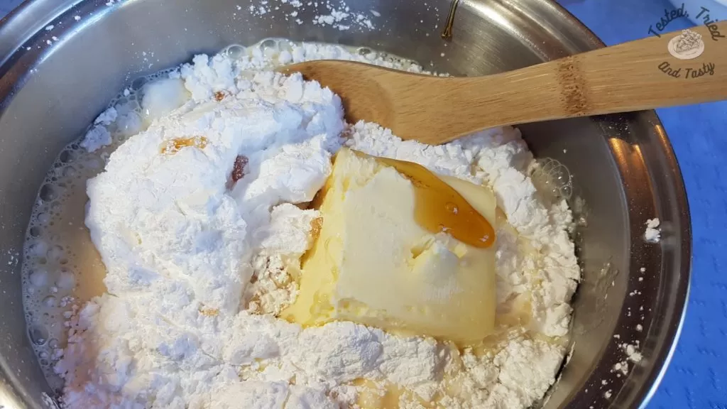 Butter, icing sugar, evaporated milk, and corn syrup in a saucepan.