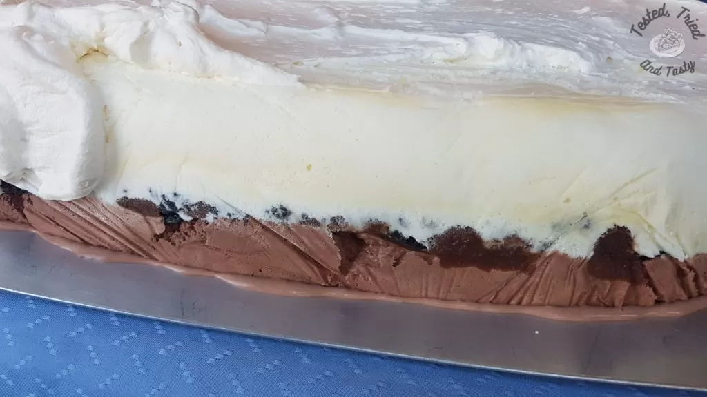 Side view of the ice cream cake before it is totally done.