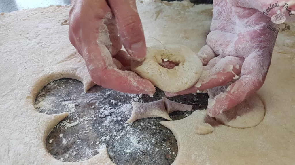 Cutting out donuts.