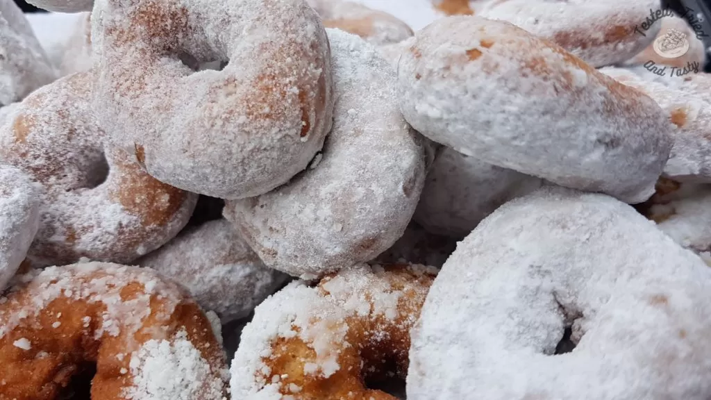 Powdered sugar mini donuts.