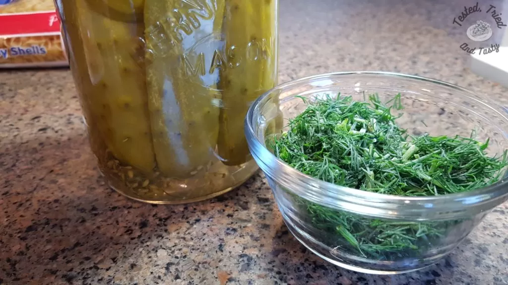 homemade sweet garlic dill pickles and fresh dill.