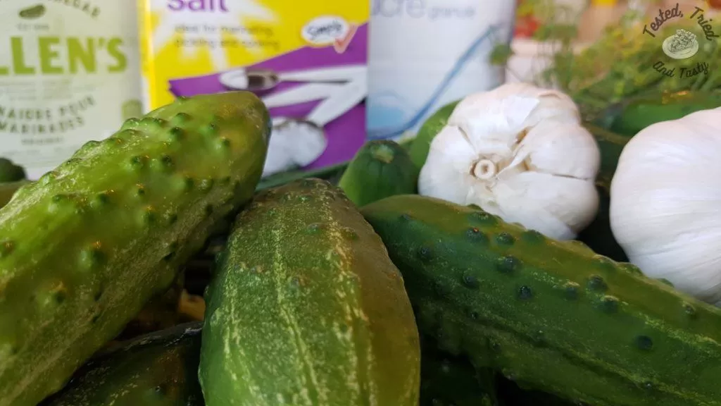 Cucumbers, garlic, dill, salt, and vinegar.