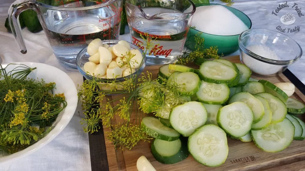 Ingredients for making sweet garlic dill pickles.