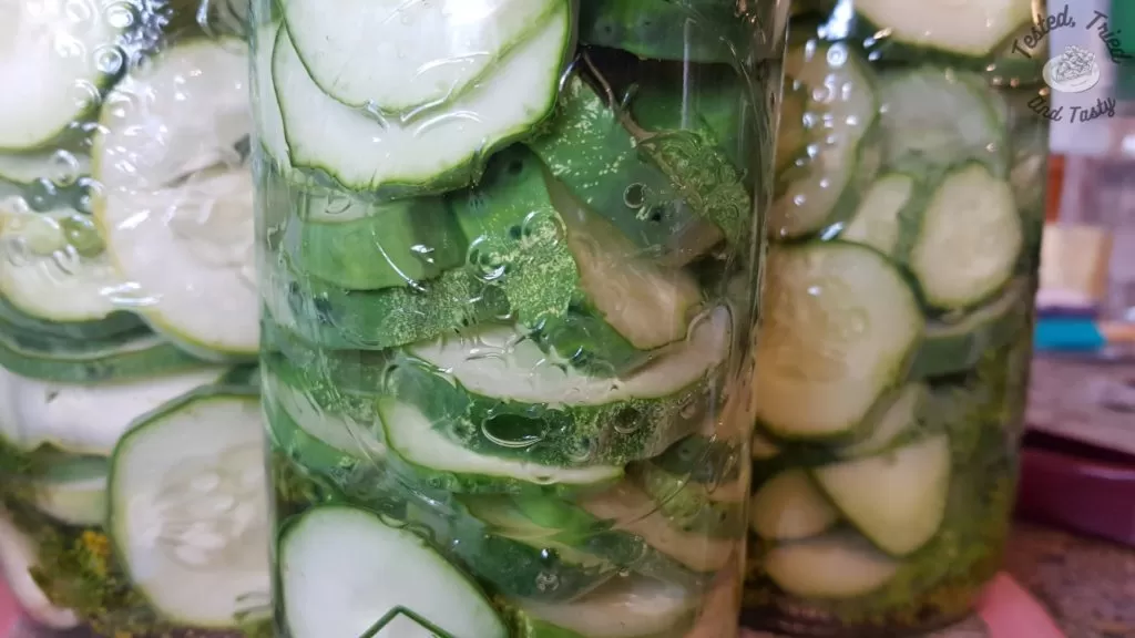 Jars of cucumbers ready to be canned.