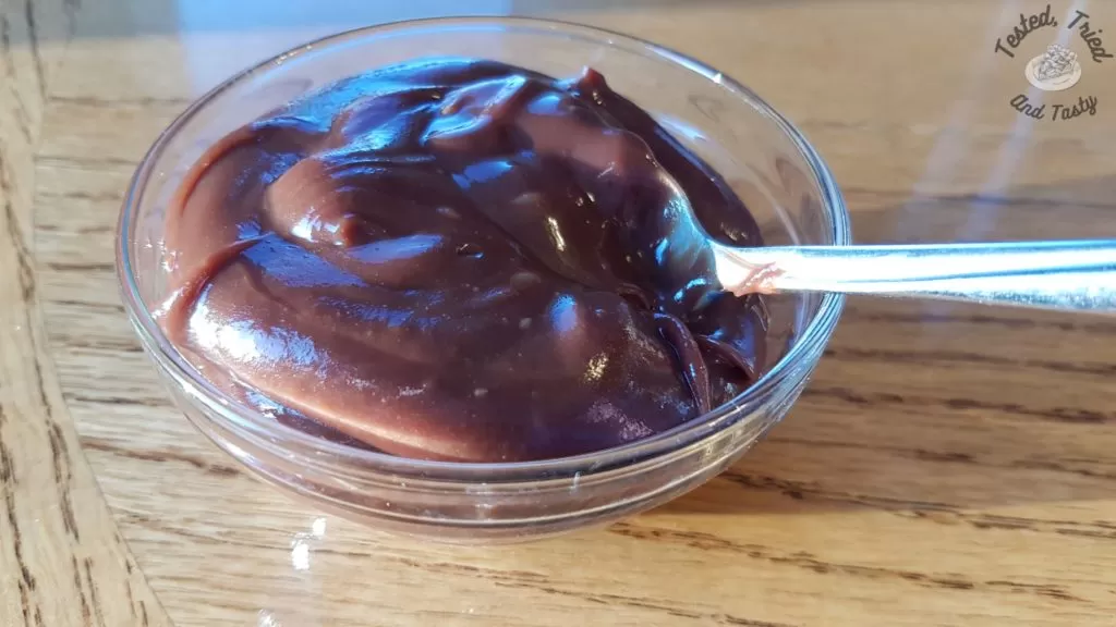 Hot fudge sauce in a glass bowl.