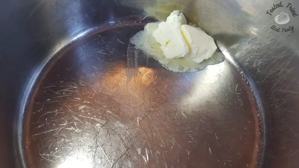 Butter in a large saucepan.