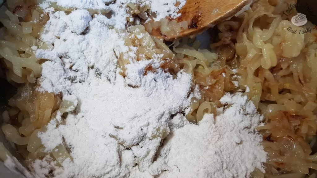 Flour salt and sugar added to caramelized onions.