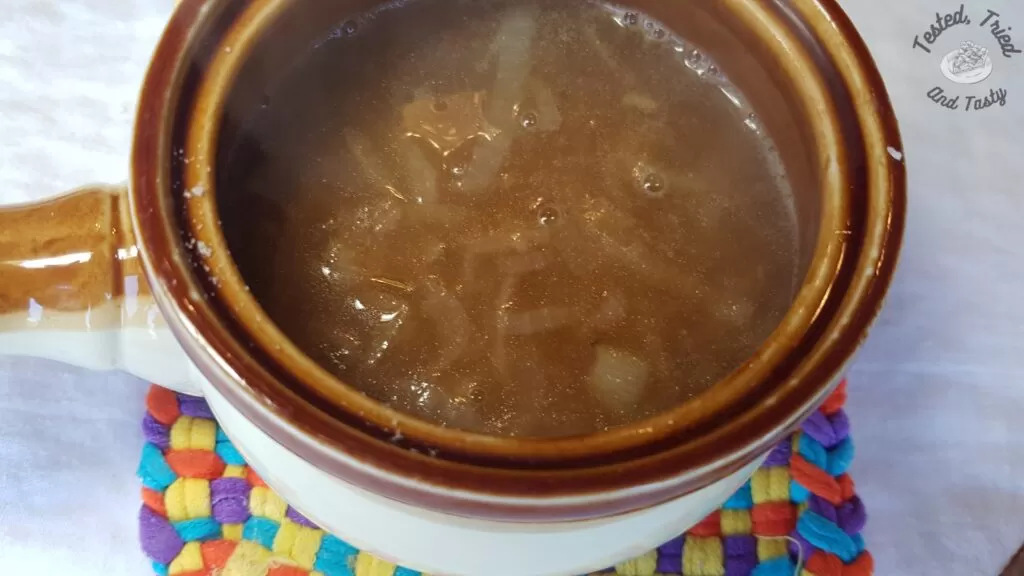 Onion soup in a ceramic crock.