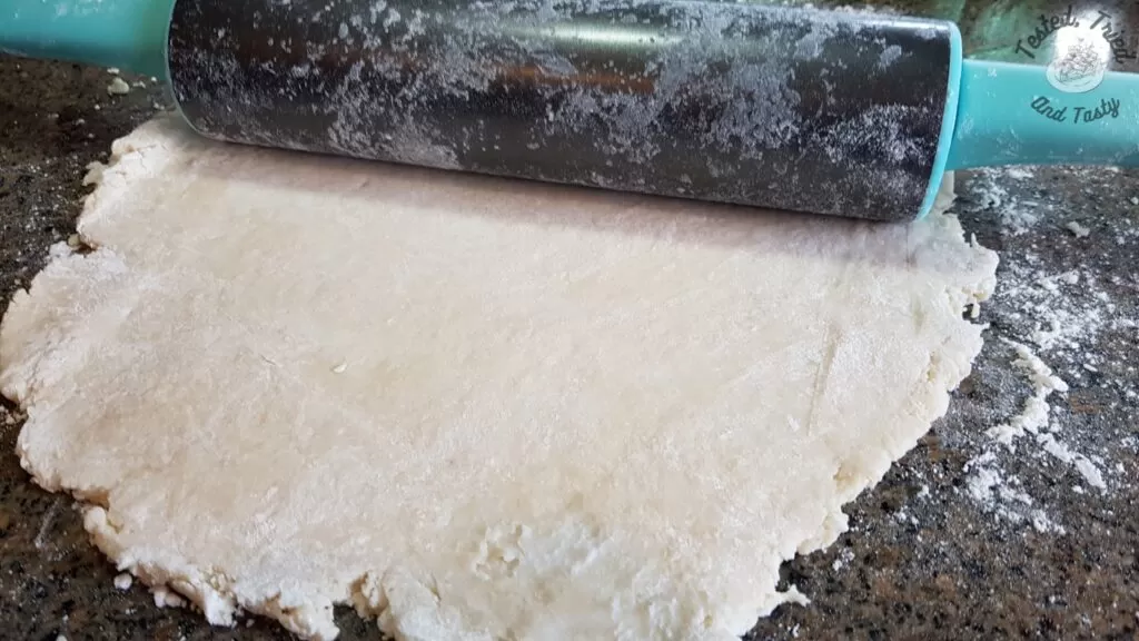 Rolling out the dough for pie.