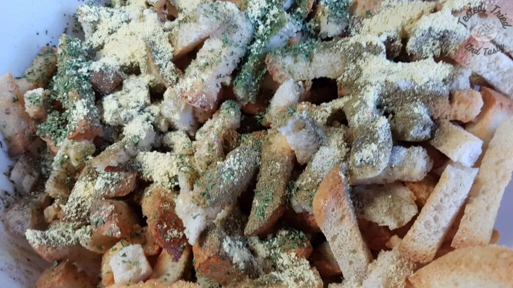 Bread cubes wit parsley flakes, poultry seasoning, salt and pepper.