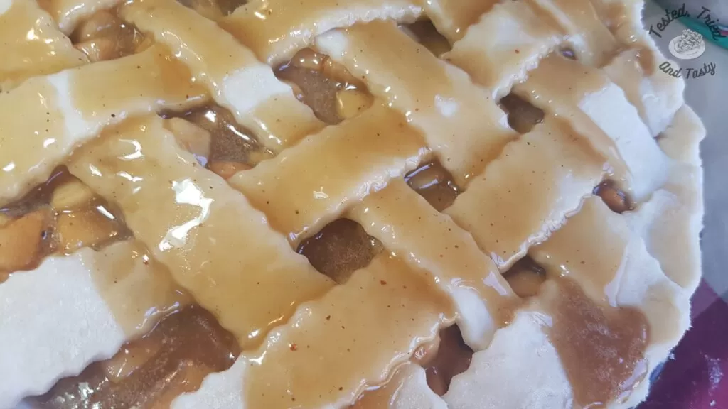Caramel sauce poured over the lattice pie crust.