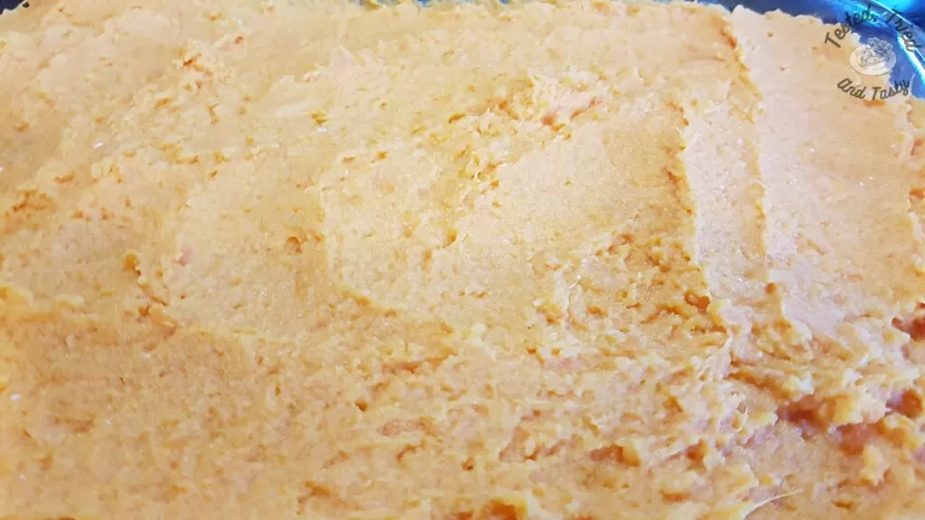 Sweet potato mixture spread in a 9x13 inch pan.