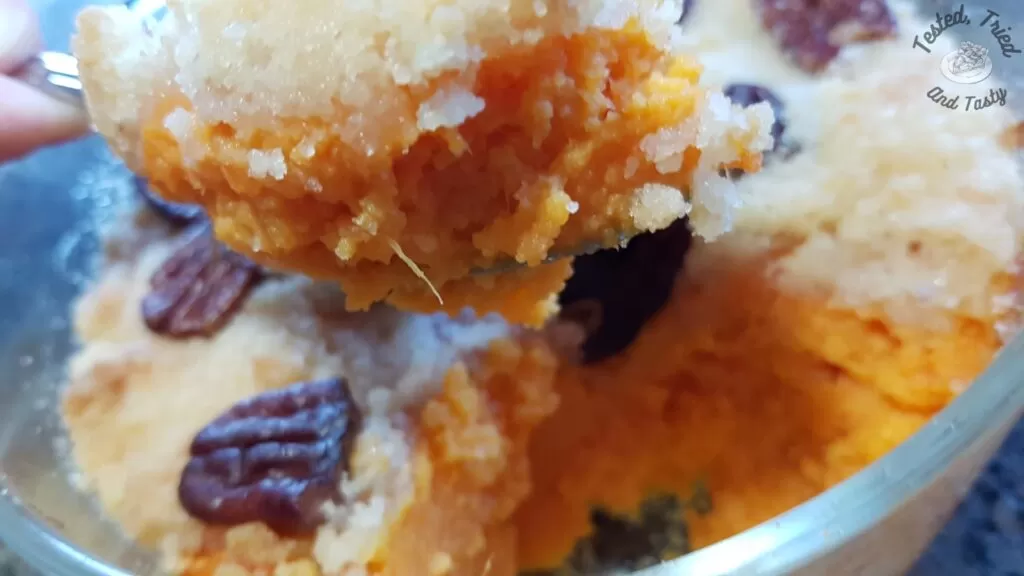 Sweet potato casserole being served.