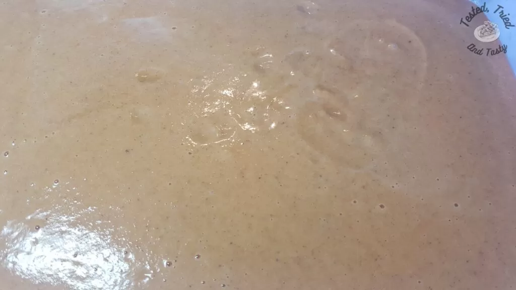 Pumpkin pie filling poured into a 9x13 inch pan.