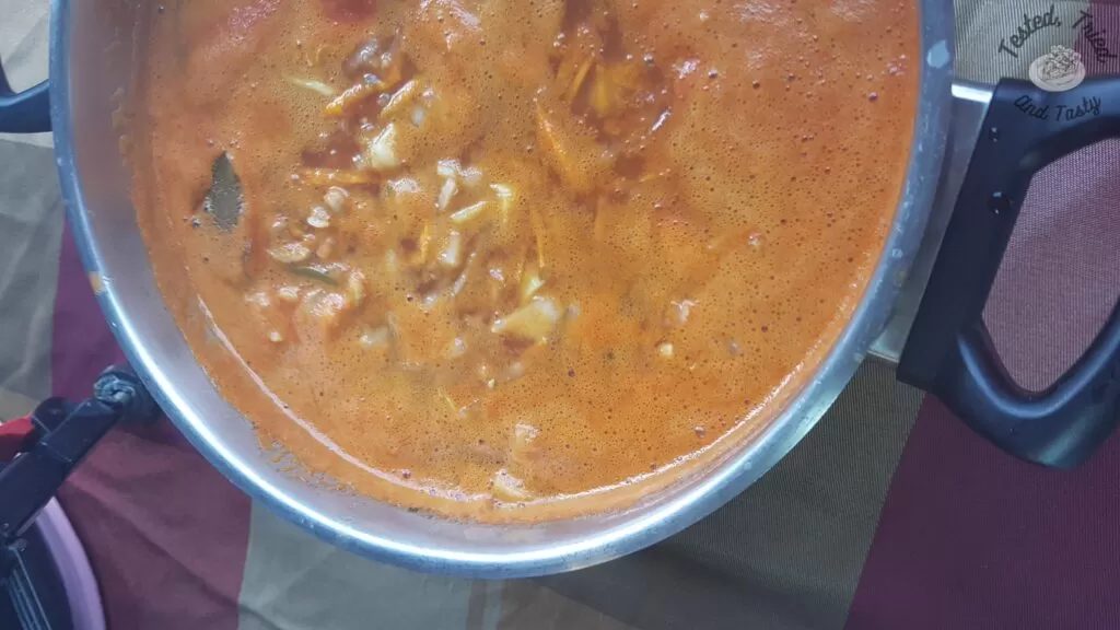 Homemade hamburger soup simmering before adding the ground beef.