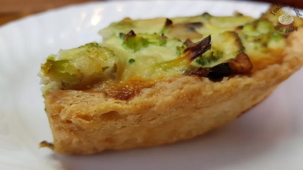 The flaky crust on a broccoli quiche.