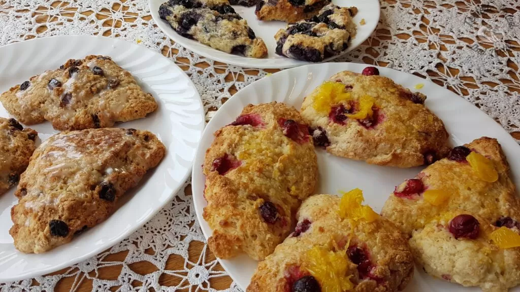 Scones recipe with glaze on white plates.