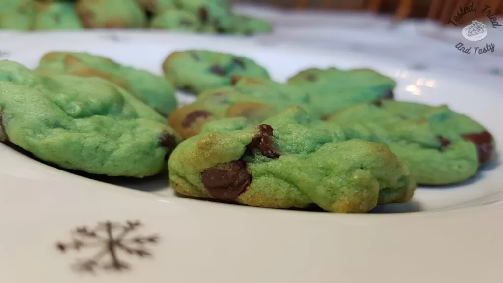 Mint chocolate chip cookies on a christmas plate.