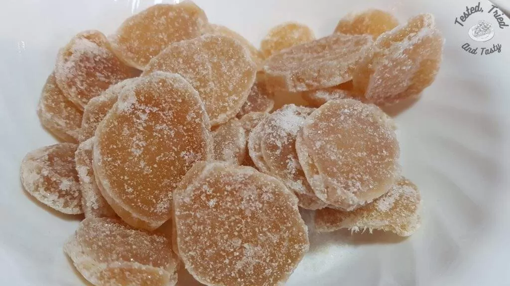 Candied or crystallized ginger in a white bowl.