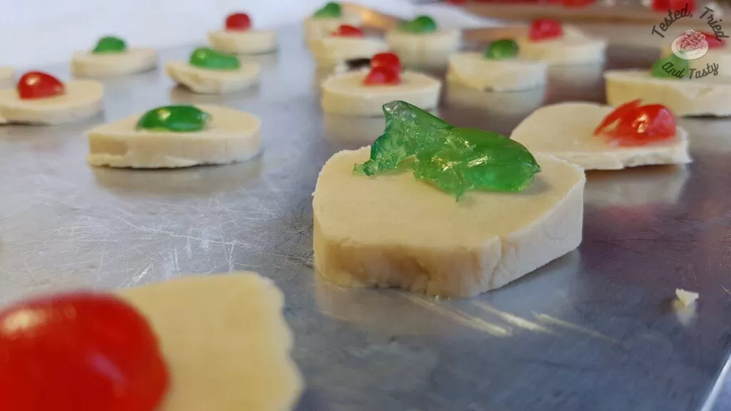 Shortbread cookies finished baking on a baking sheet.