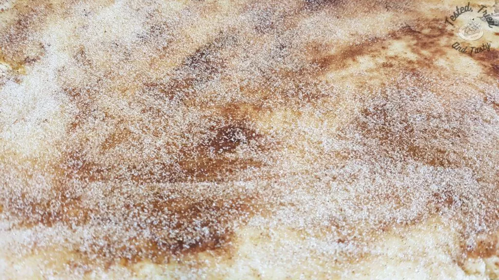 Cinnamon sugar sprinkled on the melted butter.