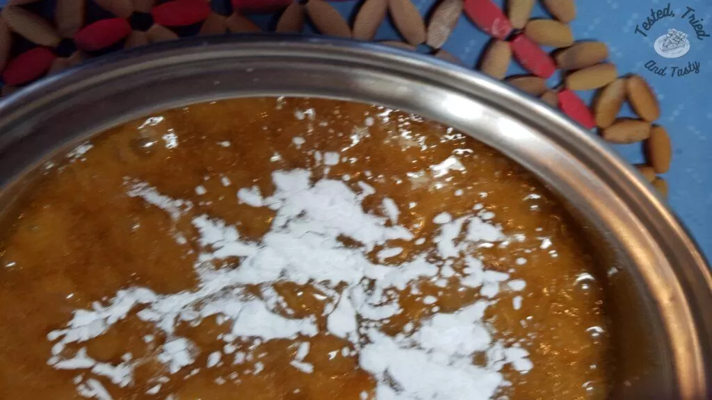 Baking soda poured onto the caramel sauce.