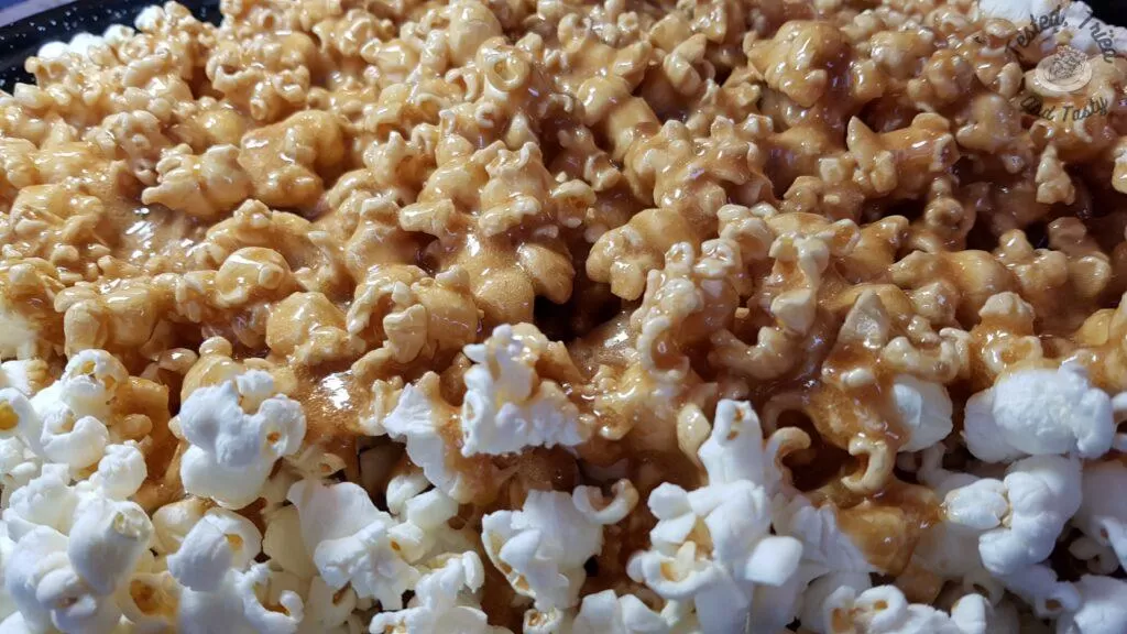 Caramel sauce poured onto popcorn.