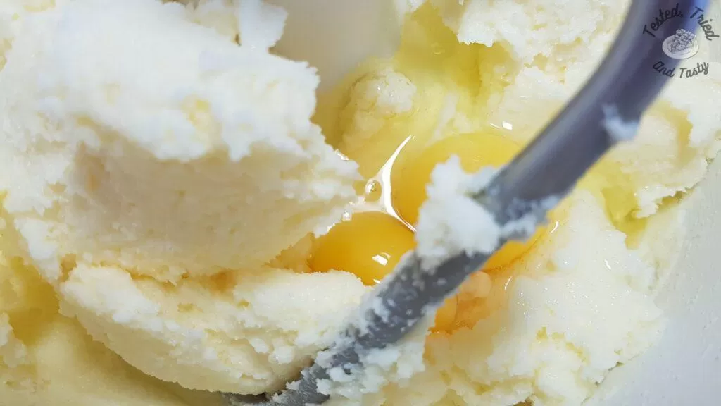 Eggs added to creamed butter and sugar.