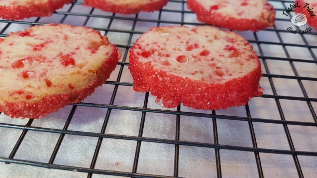 Candy cane cookies on a wire cooling rack.