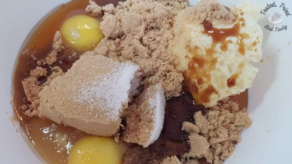 All ingredients except for the raisins in a white bowl.