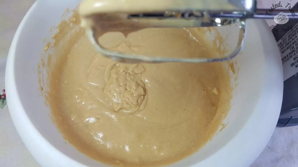 Butter tart filling mixed up in a white bowl.