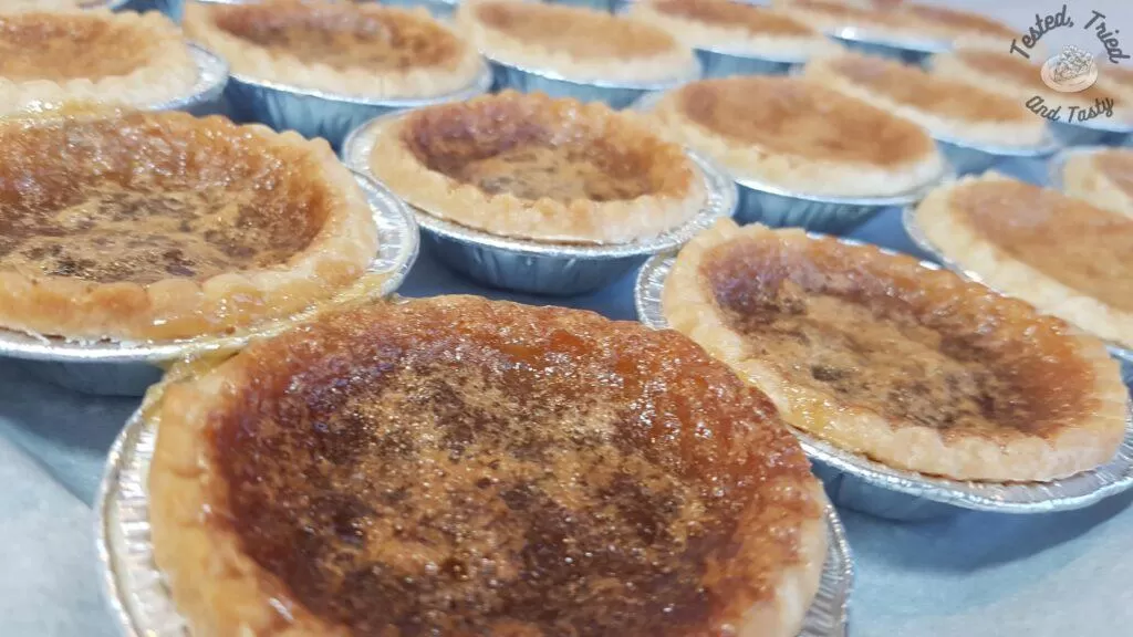 Butter tart recipe on parchment paper lined baking sheet.