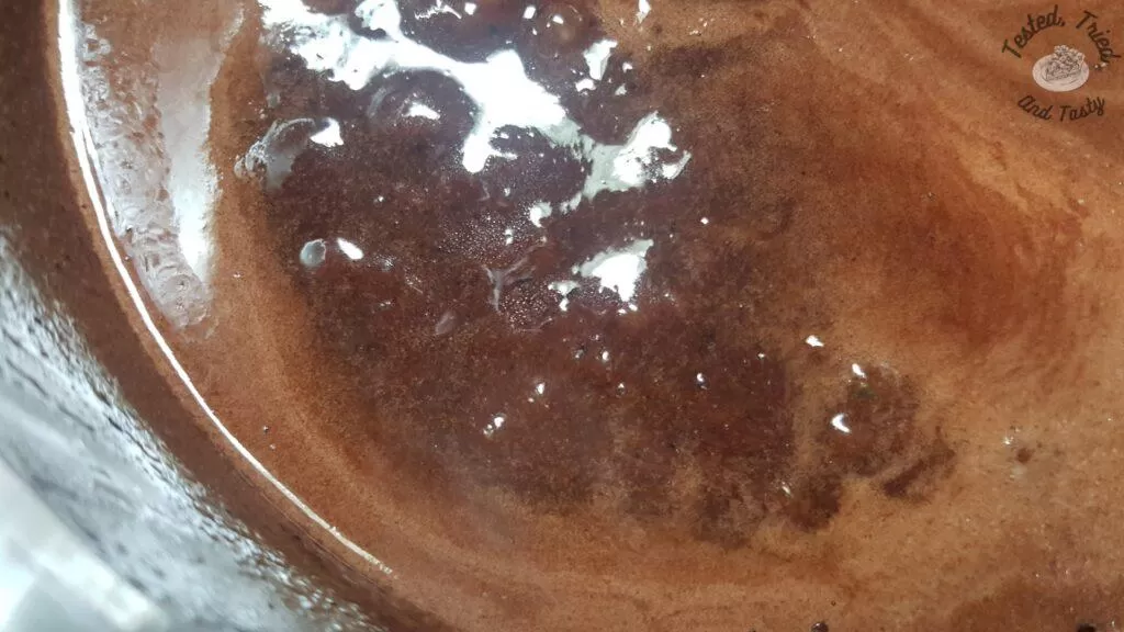 The cocoa and brown sugar mixture boiling for Nanny's famous snowballs.