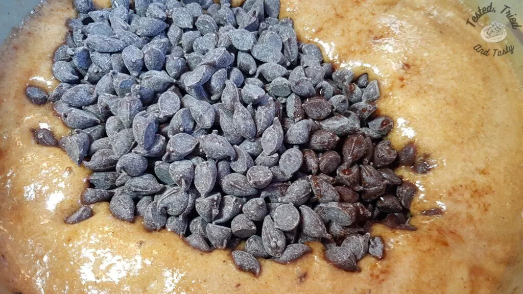 Chocolate chips added to boiled sugar and marshmallows.