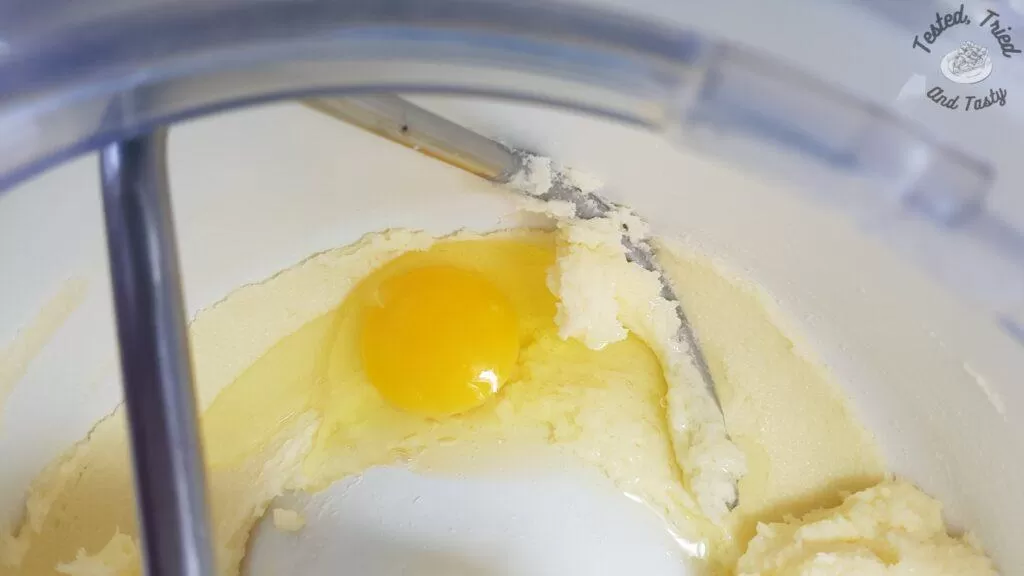 Egg added to creamed butter and sugar.
