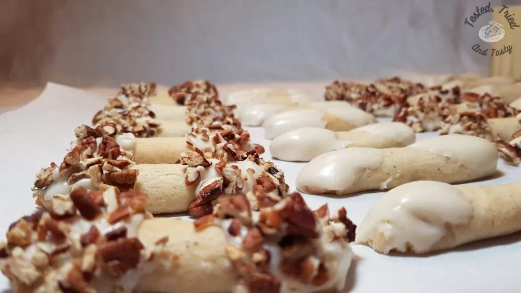 Eggnog cookies finished with and without pecans.